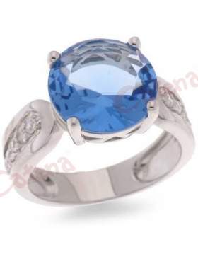 Ασημένιο δαχτυλίδι επιπλατινωμένο με άσπρες πέτρες ζιργκόν και γαλάζια στο χρώμα του νερού