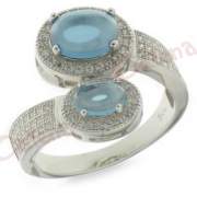 Ασημένιο δαχτυλίδι επιπλατινωμένο με άσπρες πέτρες ζιργκόν και γαλάζια στο χρώμα του νερού